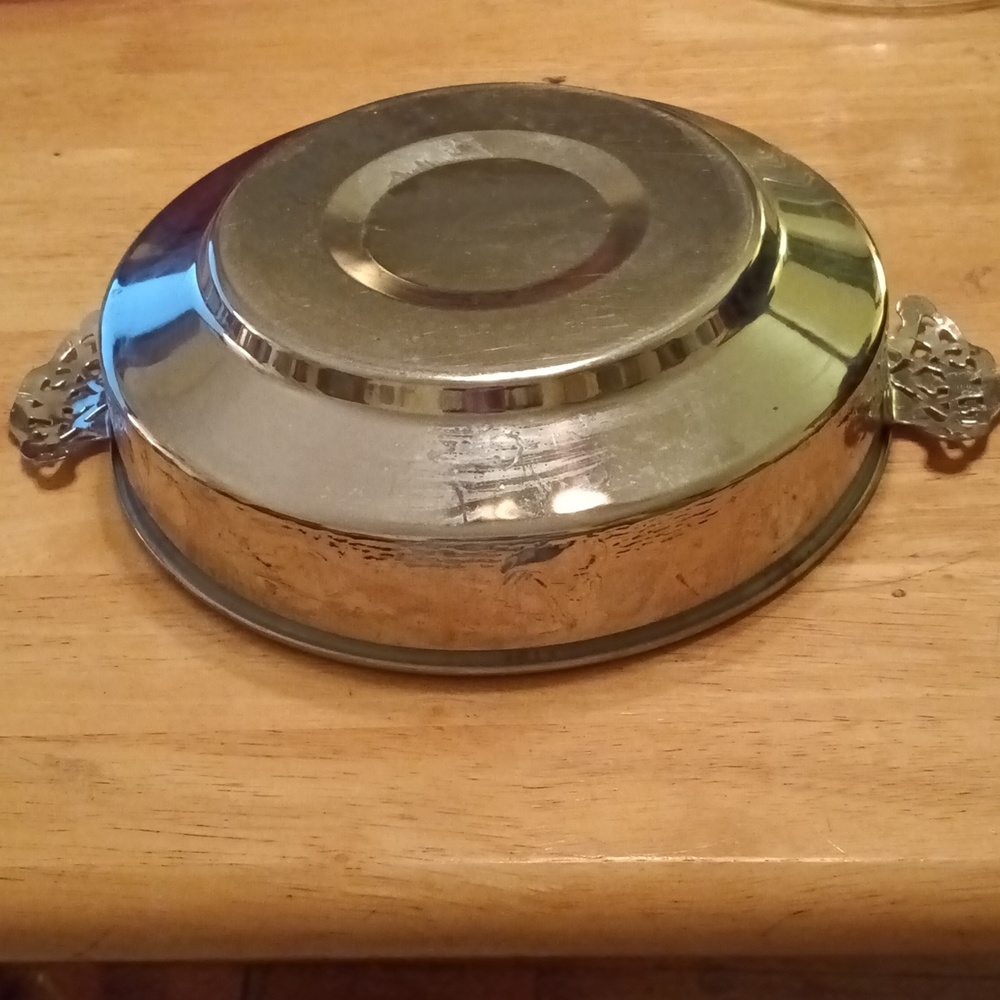 Vintage aluminum casserole dish holder/server with filigree handles.